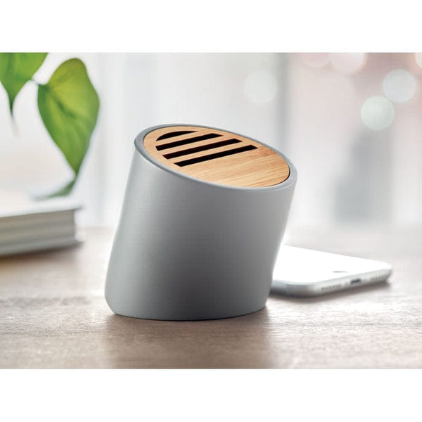 Speaker wireless in cemento calcareo e bamboo grigio - personalizzabile con logo