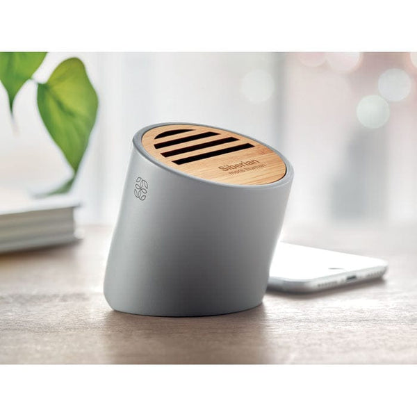 Speaker wireless in cemento calcareo e bamboo grigio - personalizzabile con logo